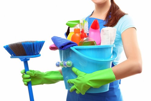 Office cleaning team maintaining a modern workplace reception area