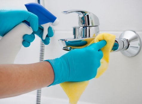 High-touch surface disinfection in a business facility